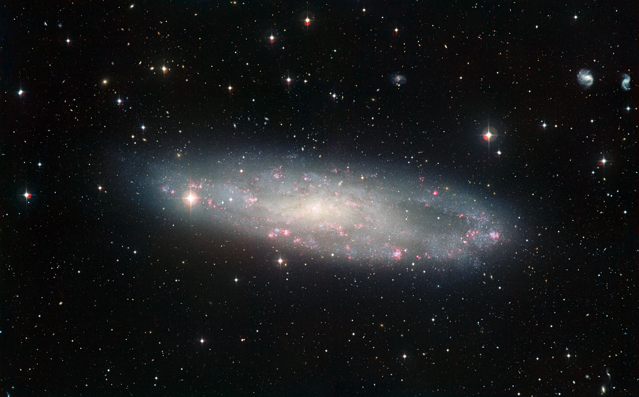 Dusty Spiral Galaxy Is Closer Than Once Thought